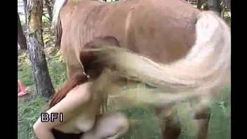 Fiery-haired babe is struggling to bang a sweet little brown pony