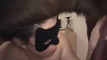 Masked bestiality-loving girl 18+ adores a canine's cock